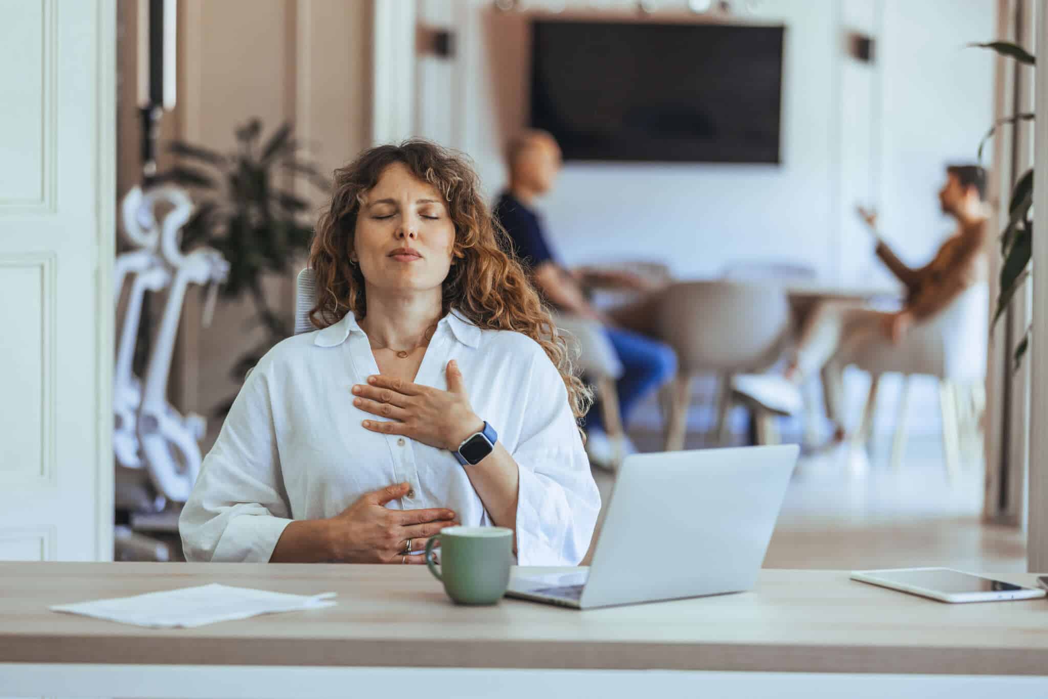 Woman sitting quietly at home, learning to turn off the mental scanning pattern and let her nervous system settle