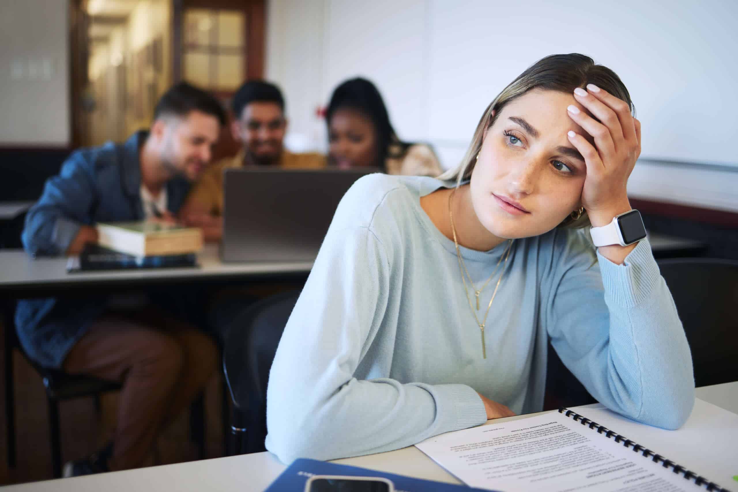 Stress, education and study with woman in classroom for exhausted, mental health and anxiety.