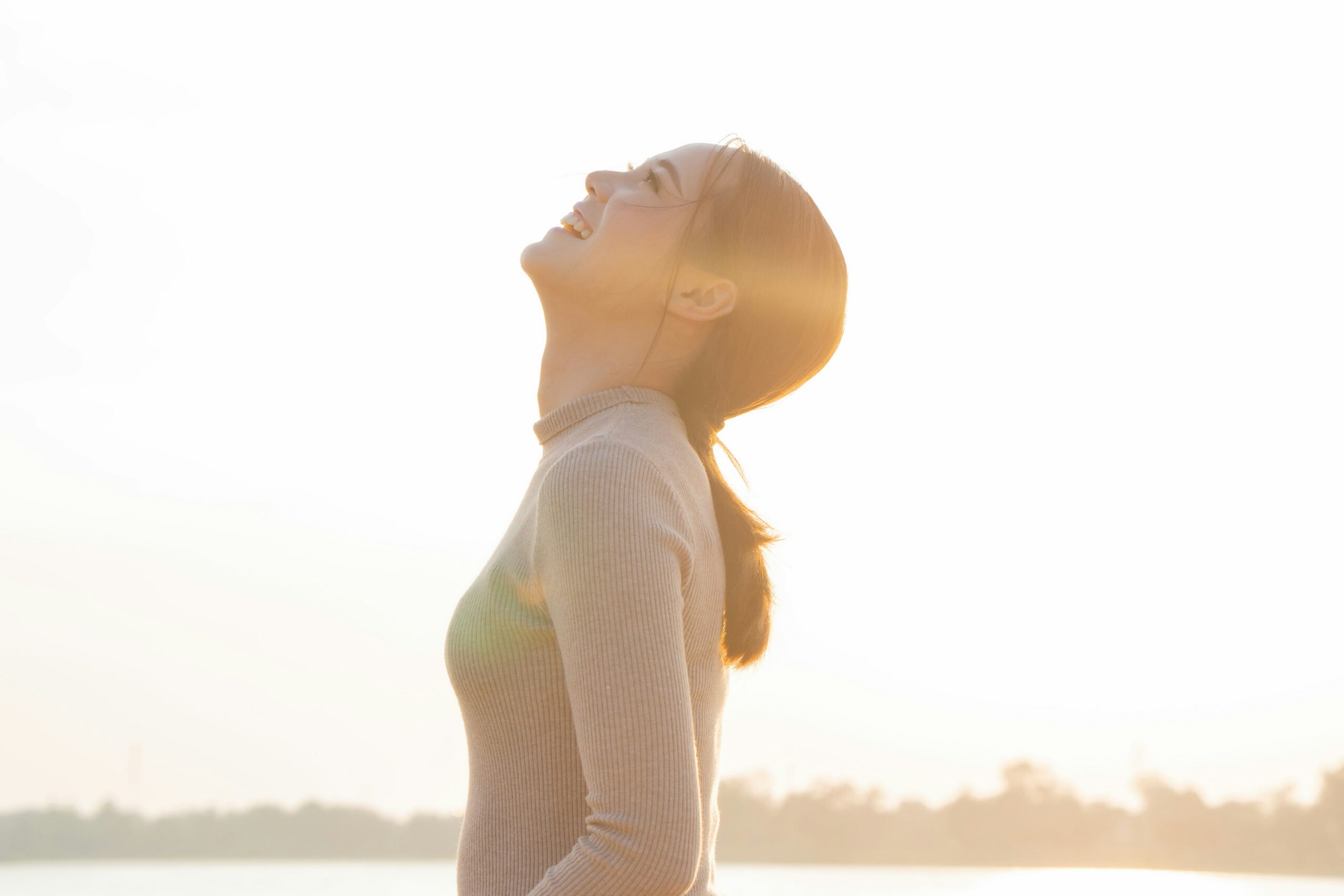happy woman looking up to the sky
